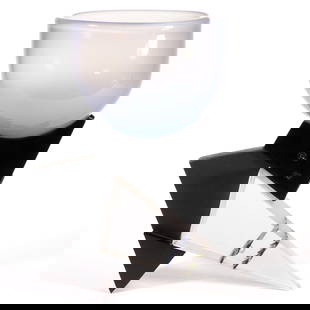 ALAN DERBYSHIRE (ENGLISH, XX/XXI) ABSTRACT METAL AND GLASS STUDIO ART GLASS SCULPTURE: ALAN DERBYSHIRE (ENGLISH, XX/XXI) ABSTRACT METAL AND GLASS STUDIO ART GLASS SCULPTURE, colorless glass triangular set into a black metal and wooden stand at an angle, to interior bands of black and gr