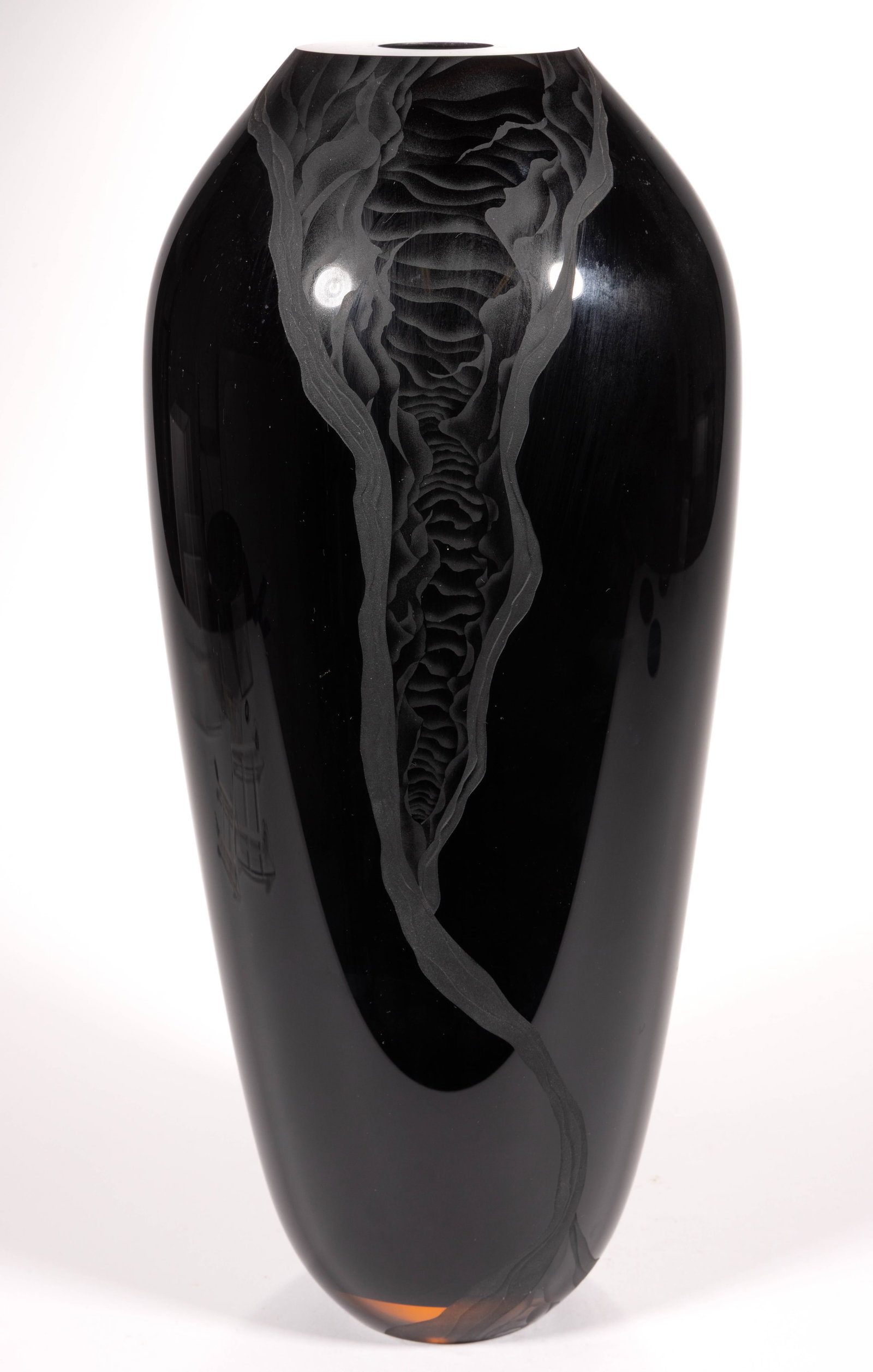 SIGNED "BLISS" CASED AND ENGRAVED STUDIO ART GLASS VASE: SIGNED "BLISS" CASED AND ENGRAVED STUDIO ART GLASS VASE, black cased peach, tall ovoid form with engraved rivers flowing from the top to the bottom of the vase, signed to the underside, &quo