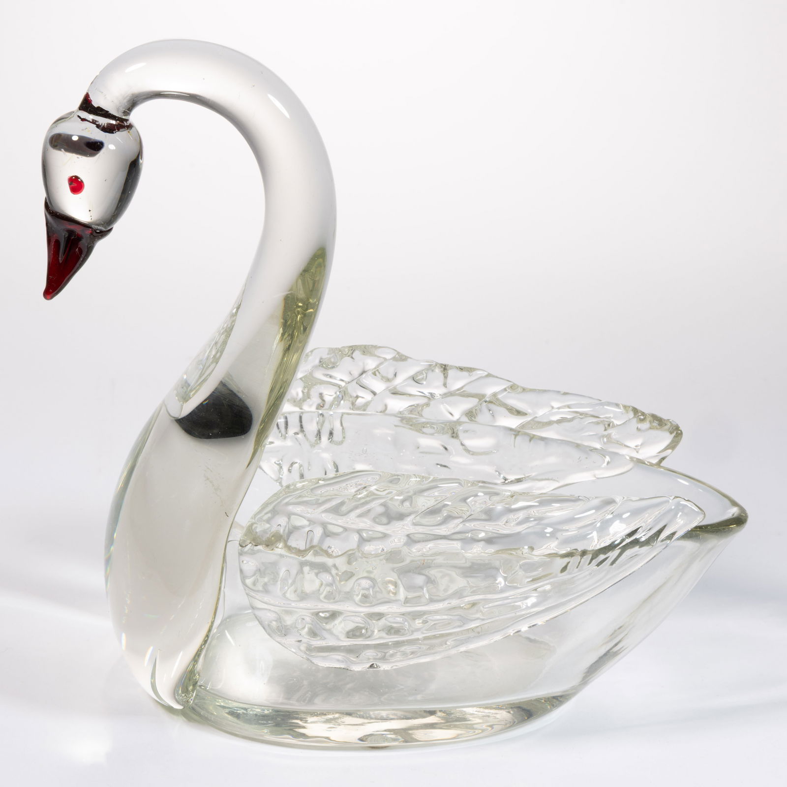 LOETZ ATTRIBUTED CRYSTAL ART GLASS FIGURAL SWAN DISH: LOETZ ATTRIBUTED CRYSTAL ART GLASS FIGURAL SWAN DISH, colorless, ovoid bowl with applied and formed neck and head with applied ruby eyes and beak, molded wings to the side, polished pontil mark and ba