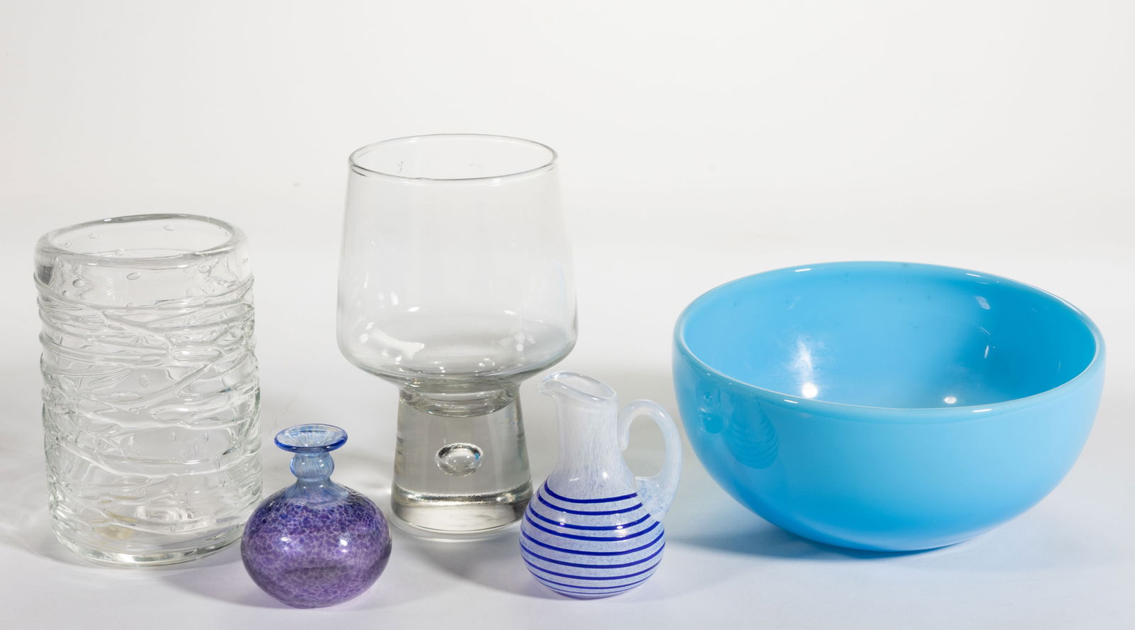 KOSTA BODA, SWEDEN AND OTHER STUDIO ART GLASS ARTICLES, LOT OF FIVE: KOSTA BODA, SWEDEN AND OTHER STUDIO ART GLASS ARTICLES, LOT OF FIVE, including a Bertil Vallien (Swedish, b. 1938) blue and purple mottled cabinet vase; a Ulrica Hydman-Vallien (Swedish, 1938-2018) op