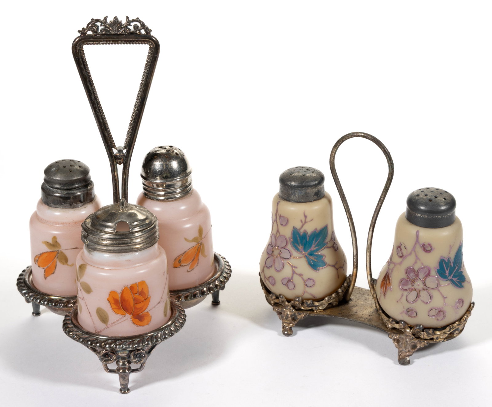 VICTORIAN ENAMEL DECORATED OPAQUE GLASS CONDIMENT SETS, LOT OF TWO: VICTORIAN ENAMEL DECORATED OPAQUE GLASS CONDIMENT SETS, LOT OF TWO, comprising a pair of Bristol opaque tan baluster form salt and pepper shakers; and three decorated opal three-bottle condiment set c