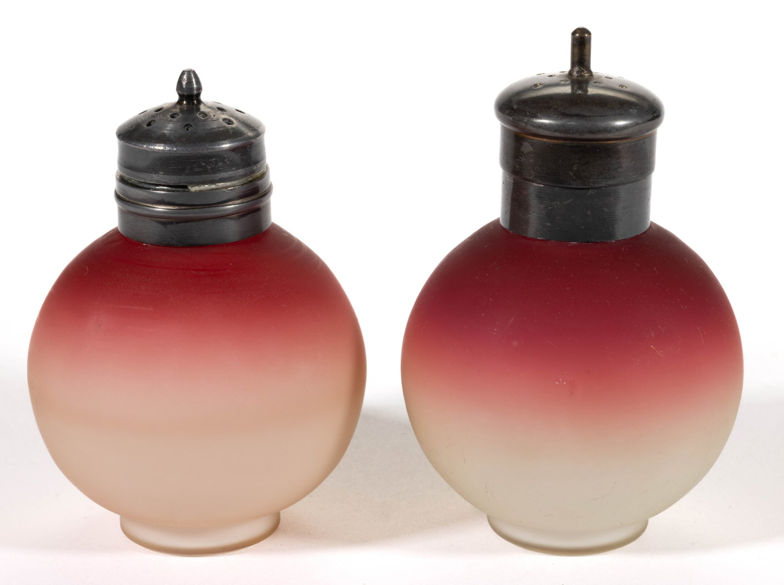 MURANO PEACHBLOW ART GLASS PAIR OF SALT AND PEPPER SHAKERS: MURANO PEACHBLOW ART GLASS PAIR OF SALT AND PEPPER SHAKERS, plush, each having a spherical form with a short foot, period collar and lid. Murano, Italy. Fourth quarter 19th/first quarter 20th century.