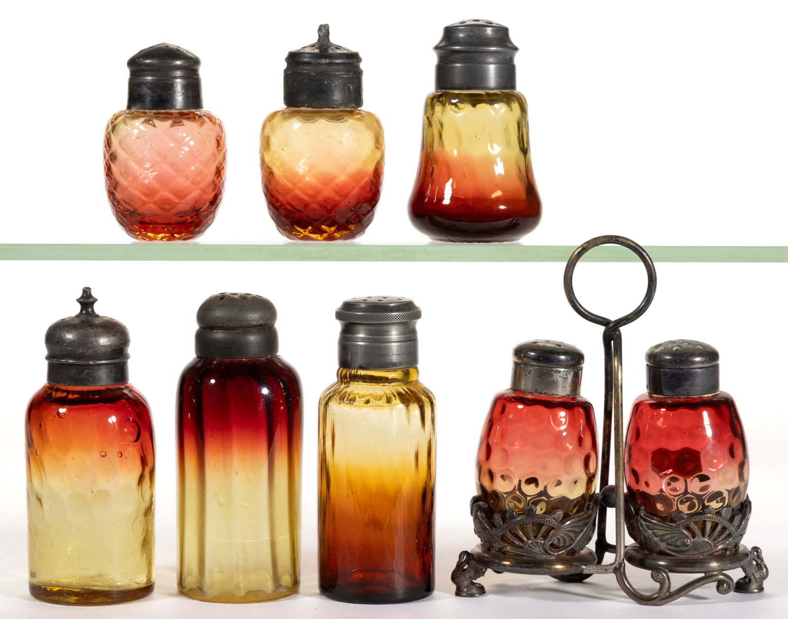 VICTORIAN AMBERINA OPTIC PATTERN GLASS SALT AND PEPPER SHAKERS, LOT OF SEVEN: VICTORIAN AMBERINA OPTIC PATTERN GLASS SALT AND PEPPER SHAKERS, LOT OF SEVEN, pale yellow/amber shaded to fuchsia, but including several "reverse Amberina" examples consisting of a Venetian 