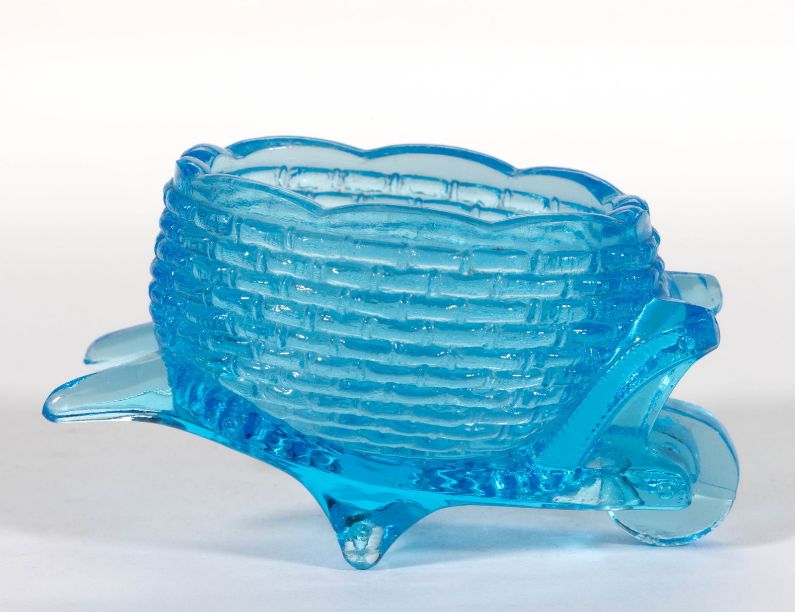GREENTOWN WHEELBARROW BLUE GLASS OPEN SALT: GREENTOWN WHEELBARROW BLUE GLASS OPEN SALT, blue. Indiana Tumbler & Goblet Co. Early 20th century. 1 7/8" H. Literature: Jyzk/Robertson - The Open Salt Compendium,&n