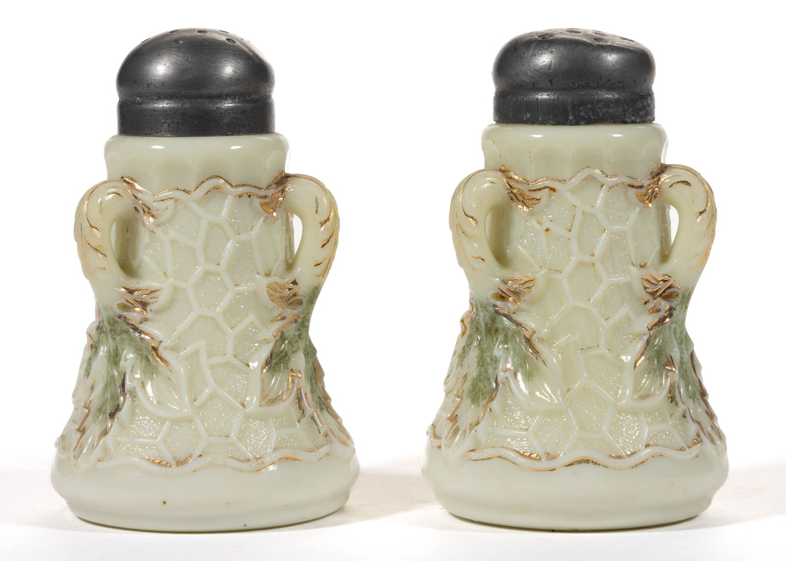 NORTHWOOD MAPLE LEAF PAIR OF SALT AND PEPPER SHAKERS: NORTHWOOD MAPLE LEAF PAIR OF SALT AND PEPPER SHAKERS, custard with green stain and gilt decoration, each having a period lid. Northwood Glass Co. Early 20th century. 3 1/2" H. 