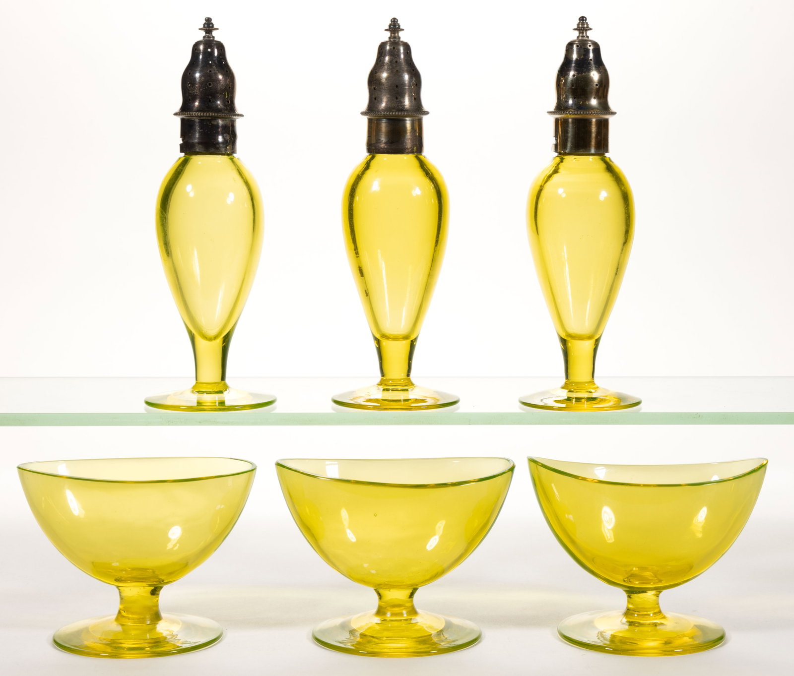 ENGLISH VASELINE FOOTED OPEN SALT AND PEPPER SHAKER SETS, LOT OF SIX PIECES: ENGLISH VASELINE FOOTED OPEN SALT AND PEPPER SHAKER SETS, LOT OF SIX PIECES, bright yellow green (reacts under black light), each salt with polished rim, each shaker with two-part silver-plate li