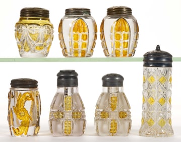 ASSORTED EAPG AMBER-STAINED SALT AND PEPPER SHAKERS, LOT OF SEVEN