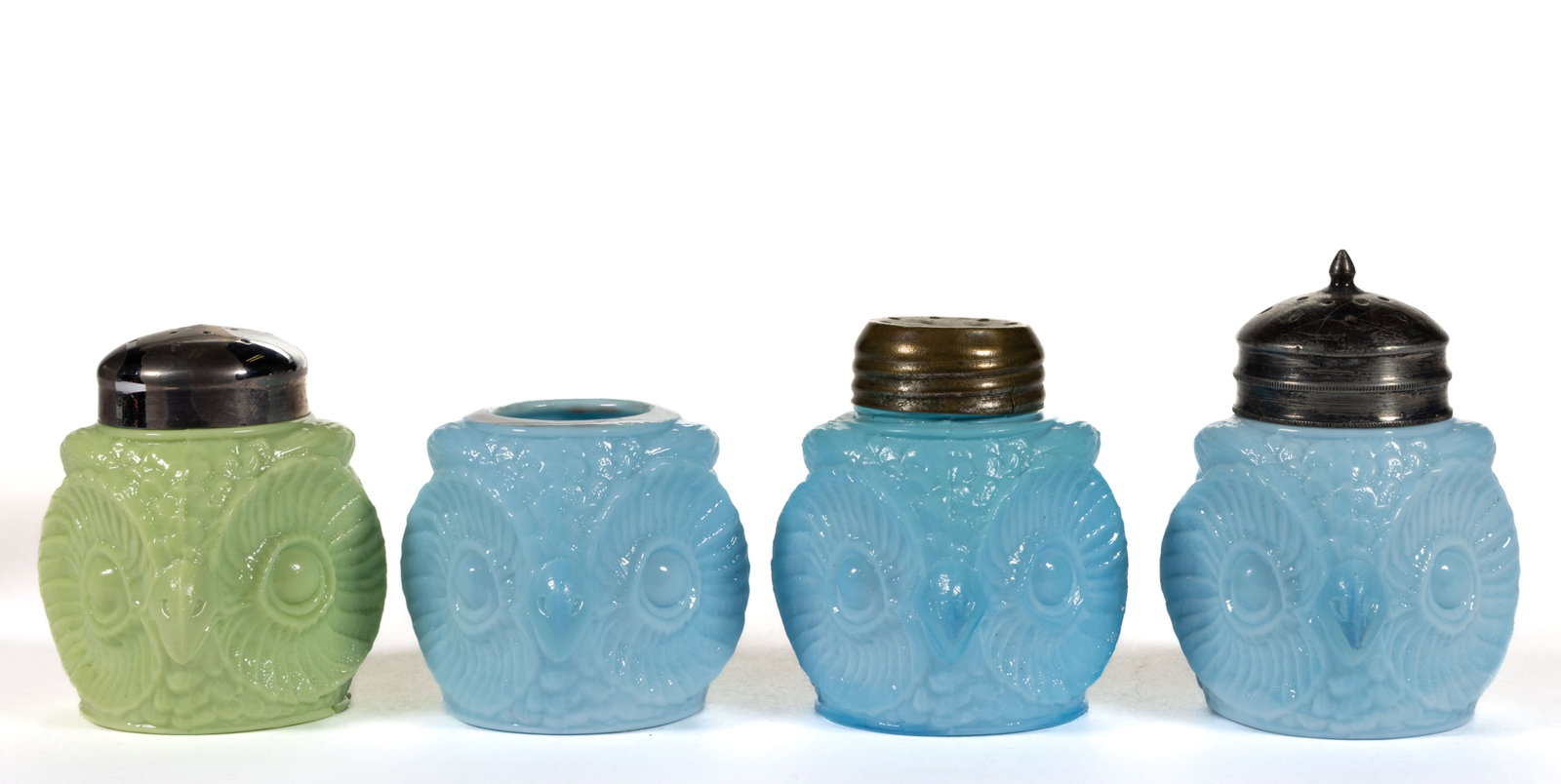 FIGURAL OWL OPAQUE GLASS SALT SHAKERS, LOT OF FOUR: FIGURAL OWL OPAQUE GLASS SALT SHAKERS, LOT OF FOUR, comprising three opaque blue and one opaque green example, three retaining period lid. Probably Challinor, Taylor & Co. Circa 1890. 2&