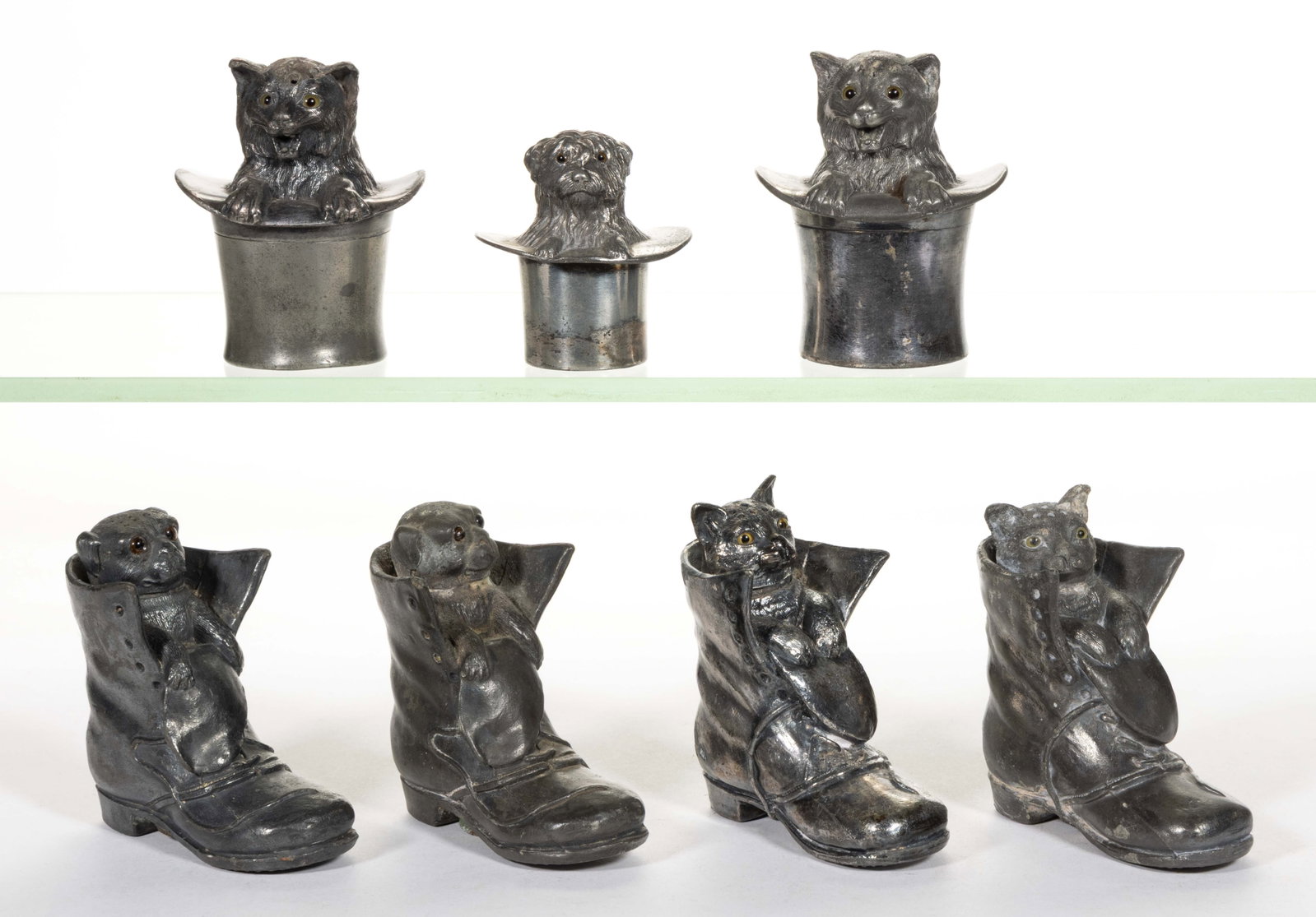 ASSORTED SILVER-PLATED FIGURAL CAT AND DOG SALT / PEPPER SHAKERS, LOT OF SEVEN: ASSORTED SILVER-PLATED FIGURAL CAT AND DOG SALT / PEPPER SHAKERS, LOT OF SEVEN, each piece having glass eyes, comprising three pieces by Meriden Silver Plate Co. of Meriden, CT (active 1869-1960s) con