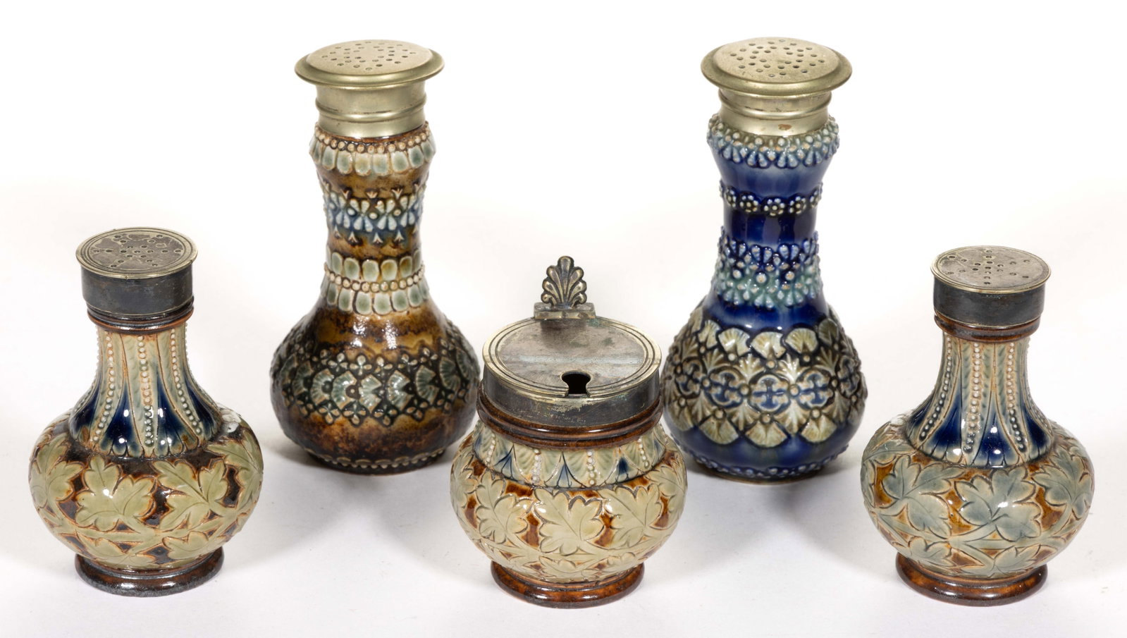ENGLISH DOULTON LAMBETH STONEWARE CONDIMENT ARTICLES, LOT OF FIVE: ENGLISH DOULTON LAMBETH STONEWARE CONDIMENT ARTICLES, LOT OF FIVE, salt-glazed, comprising two shakers having long necks with bulbous lower bodies featuring stylized shell and floral designs incl