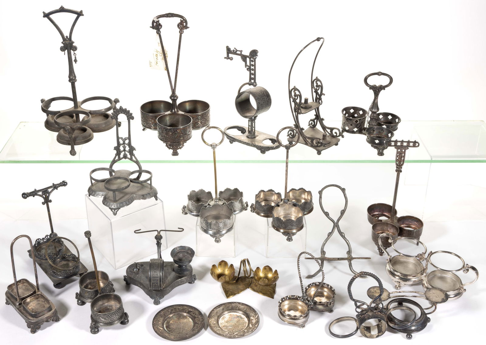 ASSORTED SILVER-PLATED / OTHER METAL CONDIMENT STANDS AND COMPONENTS, UNCOUNTED LOT: ASSORTED SILVER-PLATED / OTHER METAL CONDIMENT STANDS AND COMPONENTS, UNCOUNTED LOT, more than 15 pieces, manufactures including The Meriden Britannia Co. of Meriden, CT (active 1852-1898), Pairpoint