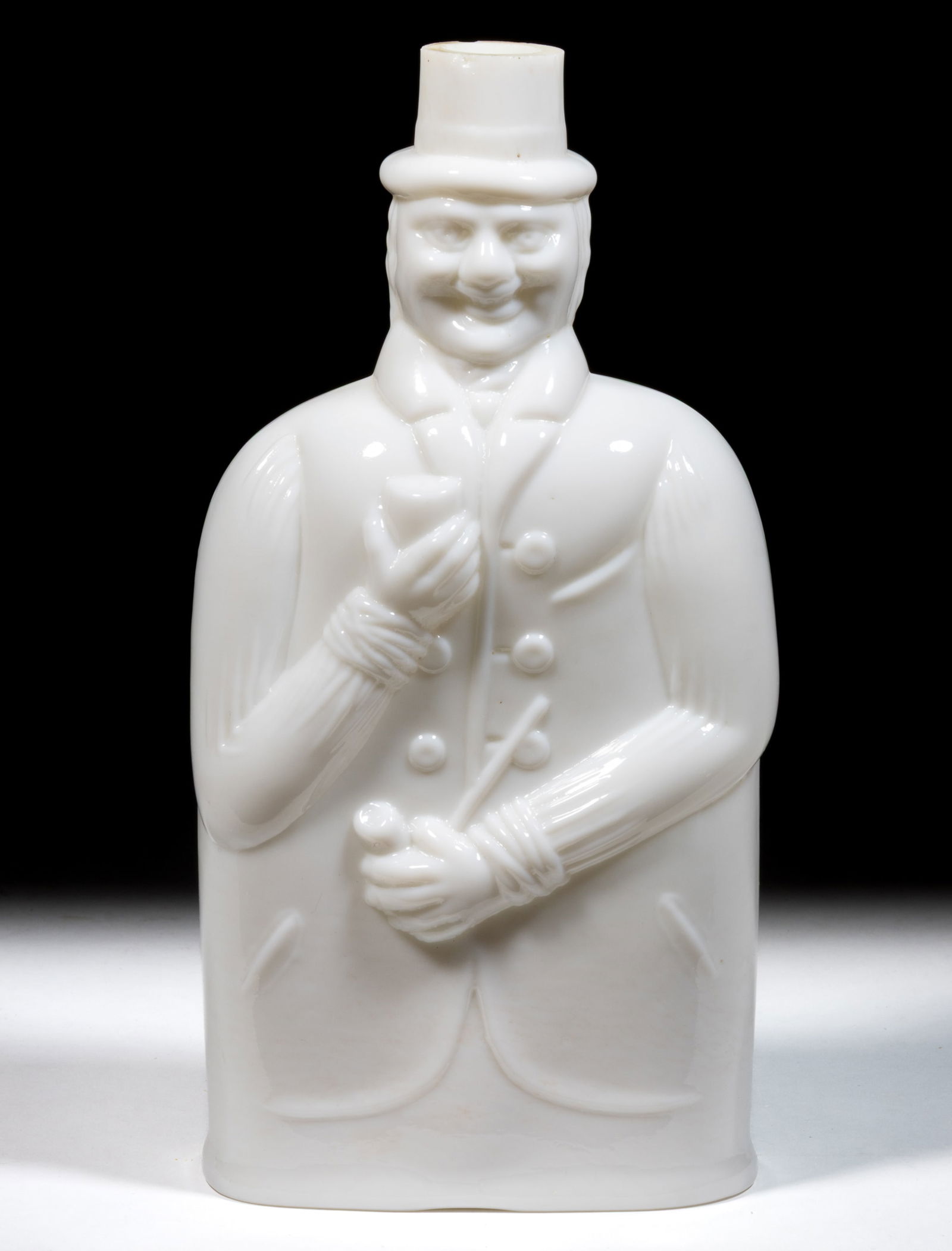 FIGURAL BLOWN-MOLDED GLASS TOBY FLASK / BOTTLE: FIGURAL BLOWN-MOLDED GLASS TOBY FLASK / BOTTLE, opaque white/milk glass, oval-shaped body in the form of a jolly man wearing a hat and coat holding a goblet in his right hand and tobacco pipe in