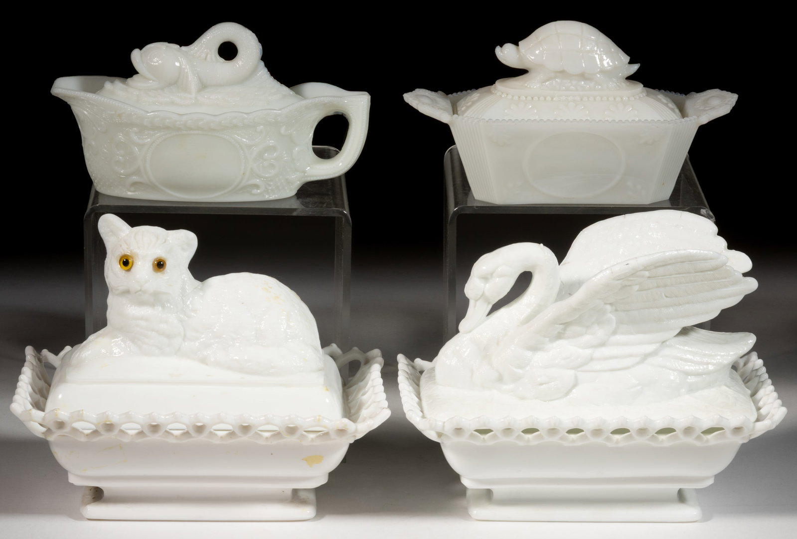 ASSORTED PRESSED GLASS NOVELTY COVERED DISHES, LOT OF FOUR: ASSORTED PRESSED GLASS NOVELTY COVERED DISHES, LOT OF FOUR, opaque white/milk glass, comprising an Atterbury Cat on Lacy Base (retaining original yellow glass eyes, with embossed patent date beneath t