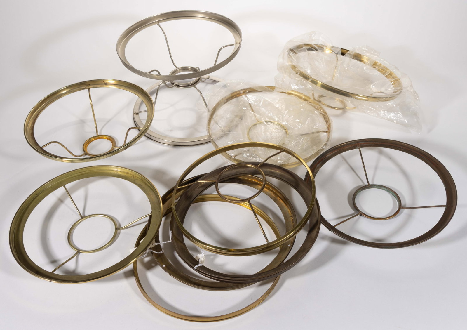 ASSORTED ALADDIN AND OTHER 10" LAMP SHADE RING HOLDERS, LOT OF 11: ASSORTED ALADDIN AND OTHER 10" LAMP SHADE RING HOLDERS, LOT OF 11, including seven with a 2" D inner ring, four with a 3 1/4" D inner ring. Together with an additional&nb