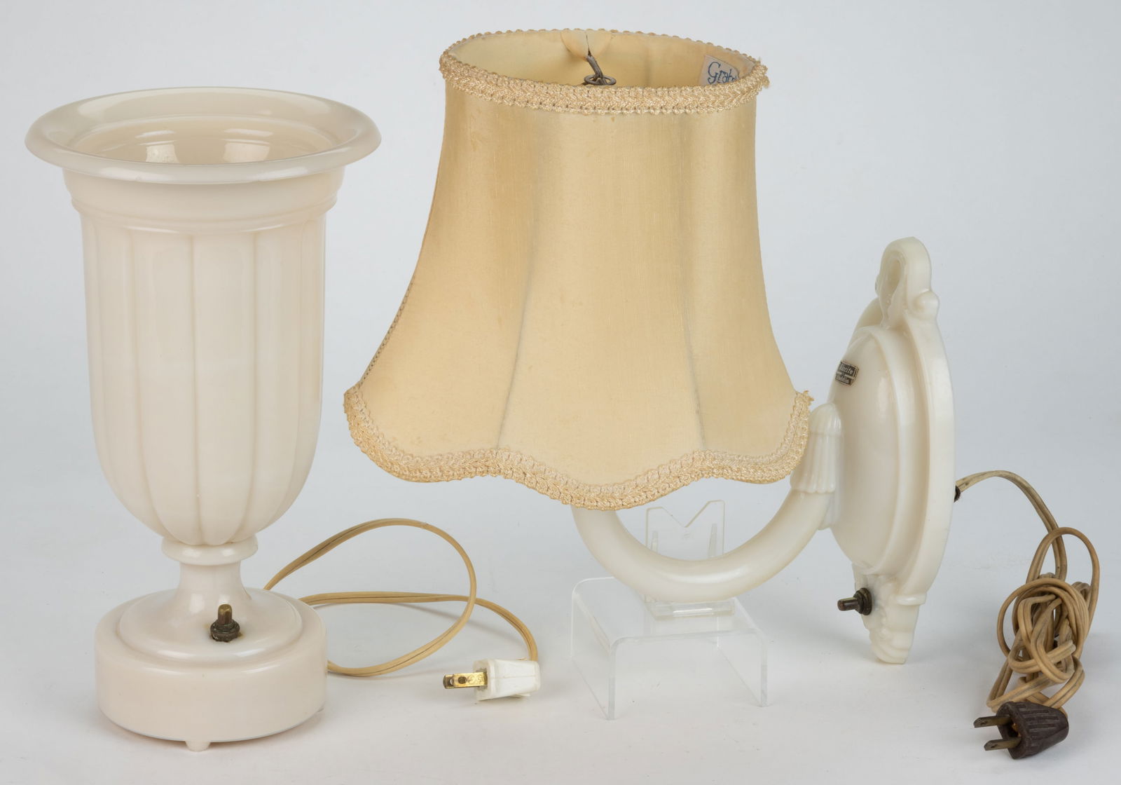 ALADDIN ALACITE ELECTRIC LAMPS, LOT OF TWO: ALADDIN ALACITE ELECTRIC LAMPS, LOT OF TWO, comprising a No. G-377 vase urn example, lacking cover, circular-form foot with underside embossed "ALADDIN"; and a No. G-353 wall sconce example,