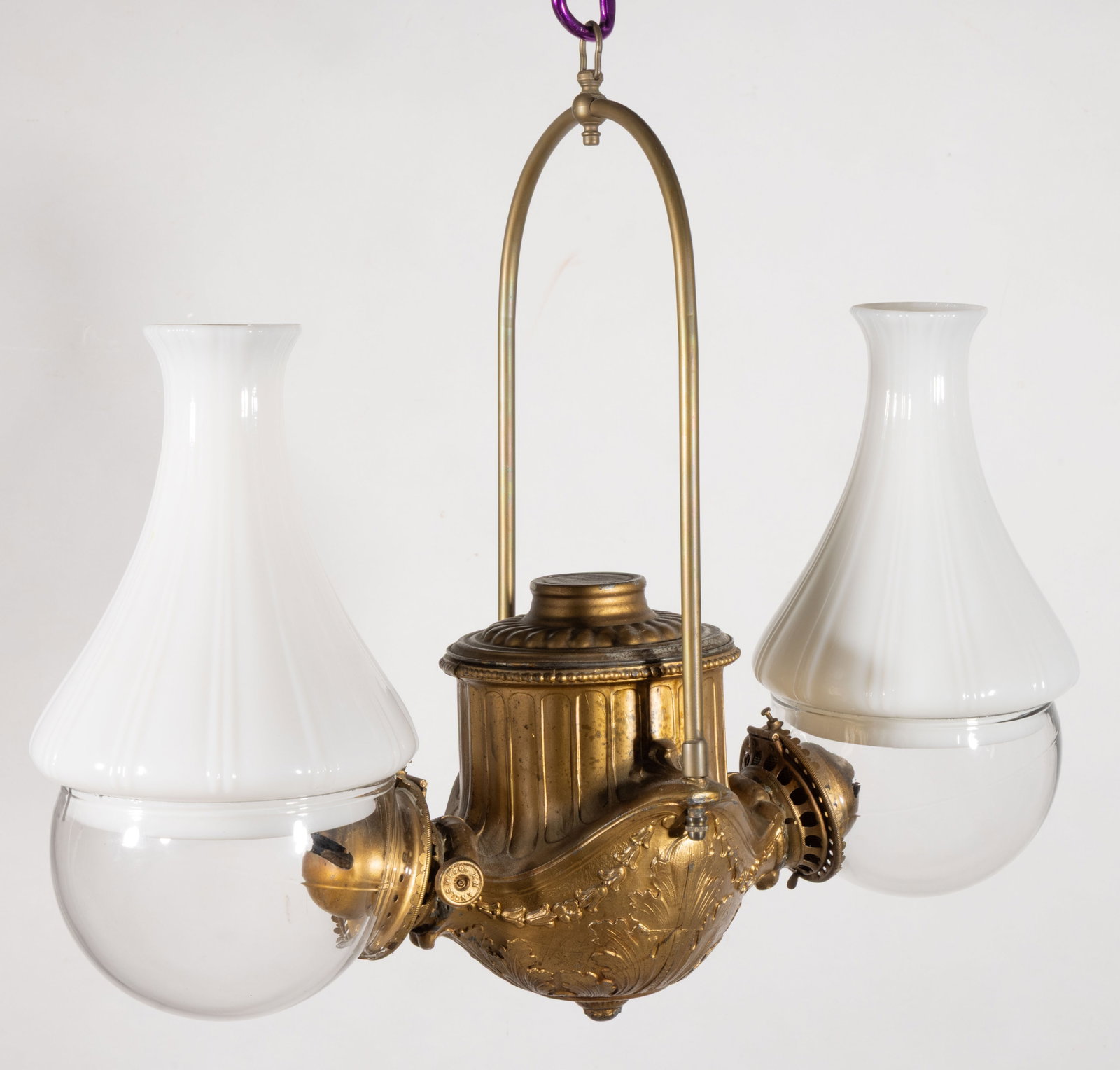 ANGLE LAMP CO. NO. 2 CLASSIC DOUBLE-ARM KEROSENE HANGING LAMP: ANGLE LAMP CO. NO. 2 CLASSIC DOUBLE-ARM KEROSENE HANGING LAMP, cast-metal frame with gilded finish, cylindrical form with embossed panels over acanthus leaf pattern, arch-form hanging arm with ho