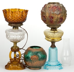 ASSORTED PATTERNED KEROSENE COMPOSITE STAND LAMPS AND SHADES, LOT OF THREE