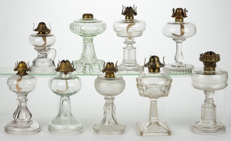 ASSORTED PATTERNED KEROSENE STAND LAMPS, LOT OF NINE