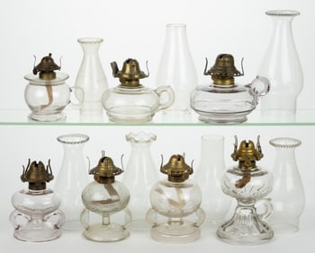 ASSORTED PATTERNED KEROSENE FINGER LAMPS, LOT OF SEVEN