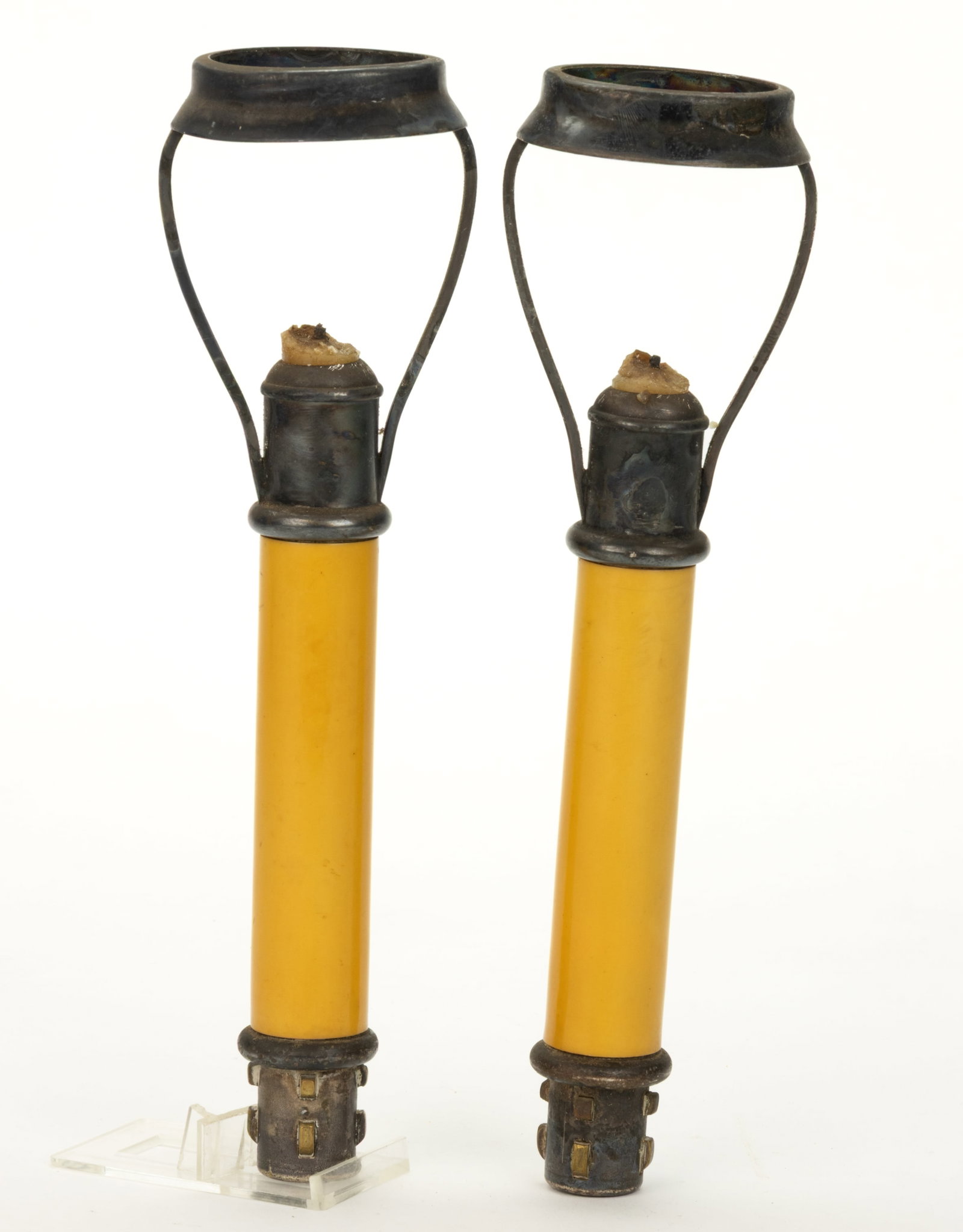 TIFFANY & CO. MINIATURE CANDLE LAMPS, PAIR: TIFFANY & CO. MINIATURE CANDLE LAMPS, PAIR, tan stick-form with silver-plated harp and fittings, each arm marked "TIFFANY & CO 6". First quarter 19th century. 9" and 9 1/8&