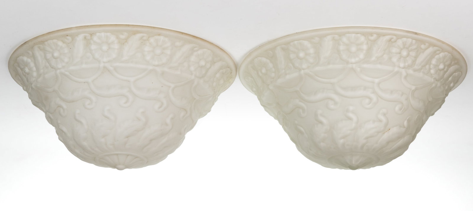 ART-DECO / ART NOUVEAU GLASS CEILING LIGHT SHADES, PAIR: ART-DECO / ART NOUVEAU GLASS CEILING LIGHT SHADES, PAIR, cased colorless with an opal interior and satin finish, dome form, overall stylized scrolls. Second quarter 20th century. 6 5/8"