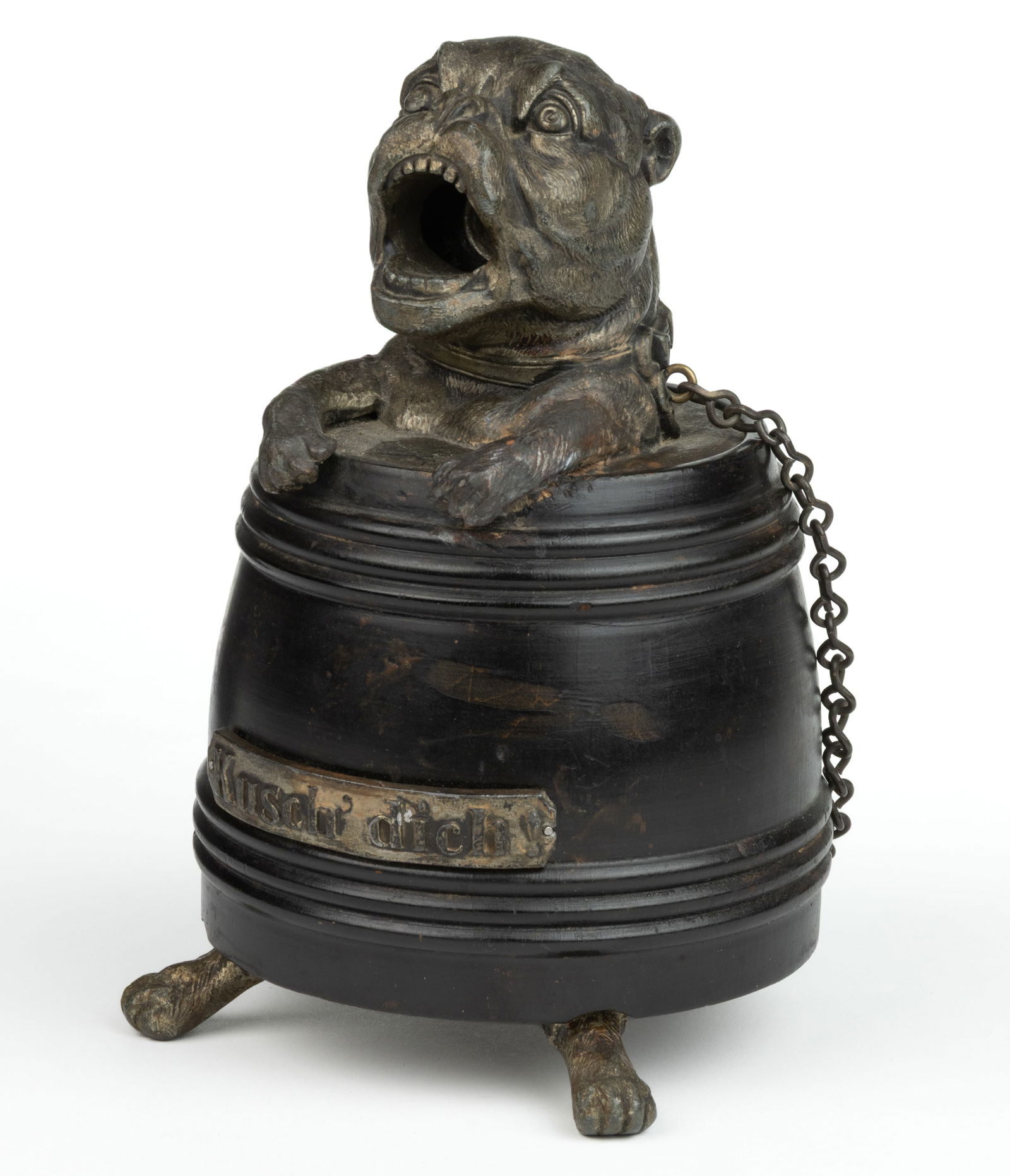 GERMAN KUSCH DICH FIGURAL DOG IN BARREL COUNTER-TOP CIGAR CUTTER: GERMAN KUSCH DICH FIGURAL DOG IN BARREL COUNTER-TOP CIGAR CUTTER, wooden barrel with original black paint and applied cast-metal label marked "KUSCH DICH!", top of barrel with a cast-metal f