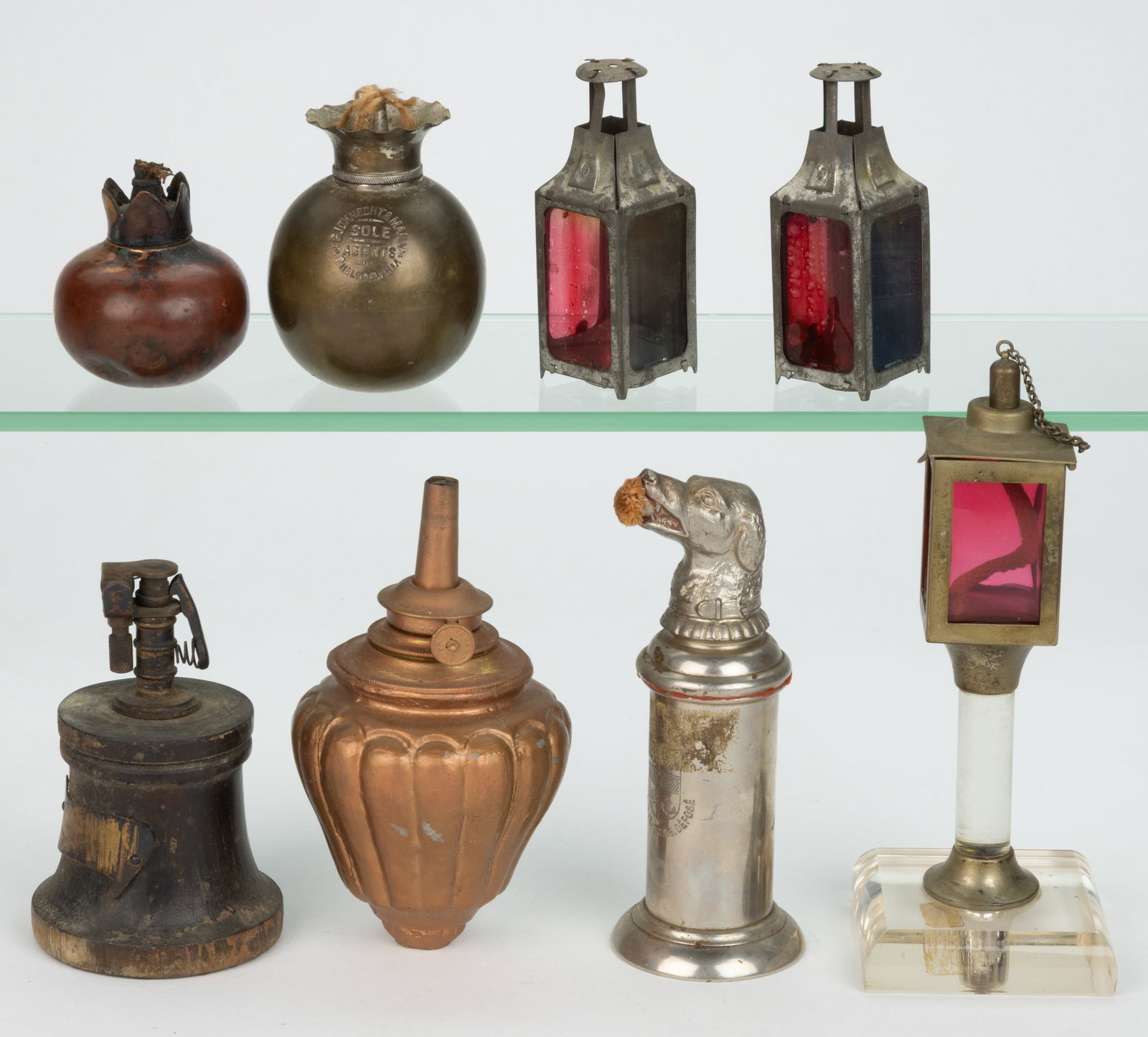 ASSORTED METALS AND WOOD TABLE-TOP CIGAR LIGHTERS, LOT OF EIGHT: ASSORTED METALS AND WOOD TABLE-TOP CIGAR LIGHTERS, LOT OF EIGHT, comprising three French examples, including a pair of sheet-iron lantern form examples, each with glass panes in various colors an