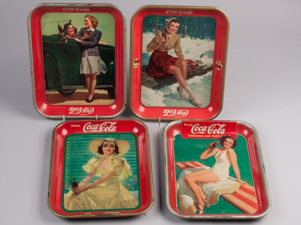 COCA-COLA TIN SERVING TRAYS, LOT OF FOUR: COCA-COLA TIN SERVING TRAYS, LOT OF FOUR, comprising 1938, 1939, 1941 and 1942. 13 1/4" x 10 1/4". Provenance: From a Connecticut private collection.
