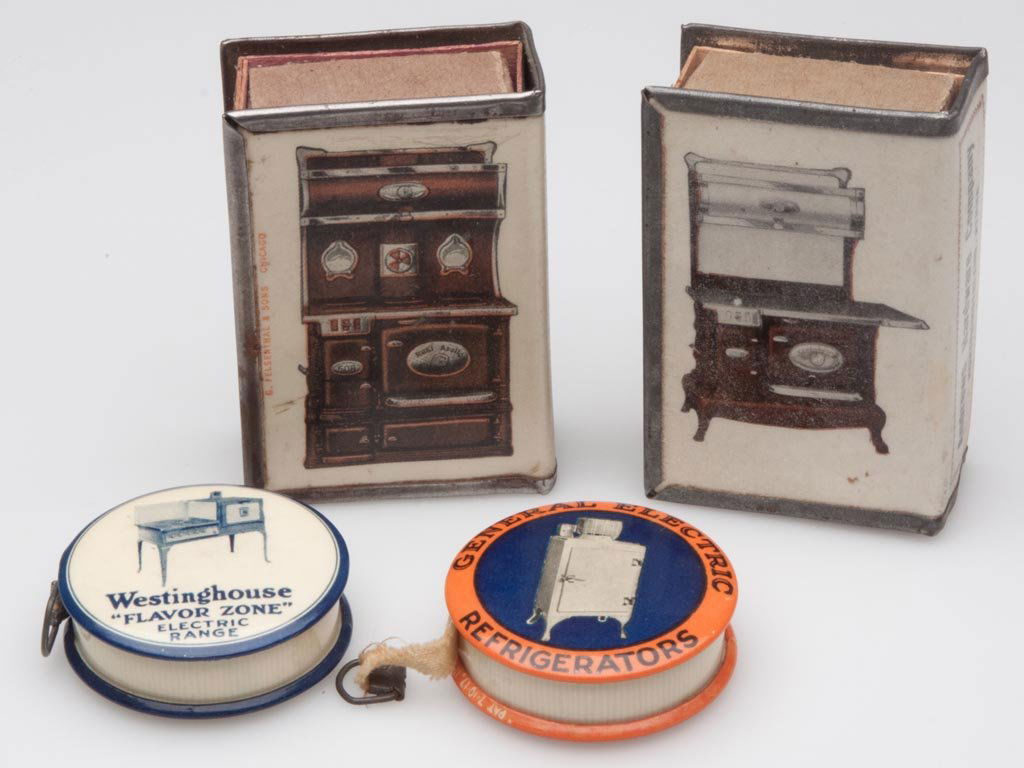 KITCHEN APPLIANCE ADVERTISING ITEMS, LOT OF FOUR: KITCHEN APPLIANCE ADVERTISING ITEMS, LOT OF FOUR, celluloid, comprising two tape measures and two match covers, General Electric refrigerators, Westinghouse "Flavor Zone" electric range, and two diffe