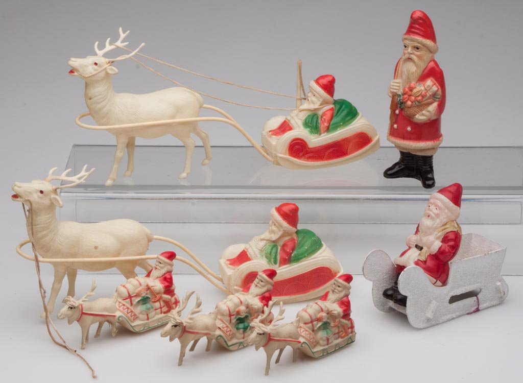 CELLULOID SANTA CLAUS DECORATIONS / TOYS, LOT OF SEVEN: CELLULOID SANTA CLAUS DECORATIONS / TOYS, LOT OF SEVEN, standing figure is a rattle. Mid 20th century. 2" to 5 1/4" H. Provenance: From the collection of the late Betty Jane Renn, Sunbury, PA.