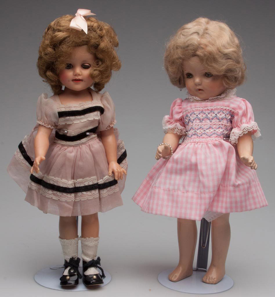 SHIRLEY TEMPLE DOLLS, LOT OF TWO: SHIRLEY TEMPLE DOLLS, LOT OF TWO, unmarked composition with modern clothing, and an Ideal vinyl with trigeminal clothing. Circa 1940-1960. 14 1/2" H. Provenance: Collection of the late Veronica "Ronni