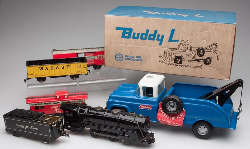 ASSORTED TIN TOYS, LOT OF SIX: ASSORTED TIN TOYS, LOT OF SIX, comprising a Marx locomotive, four Mar-Lines train cars, and a Buddy-L Flat Tire Wrecker with original box. 20th century. Wrecker 14 1/2" L. Provenance: Collection of th