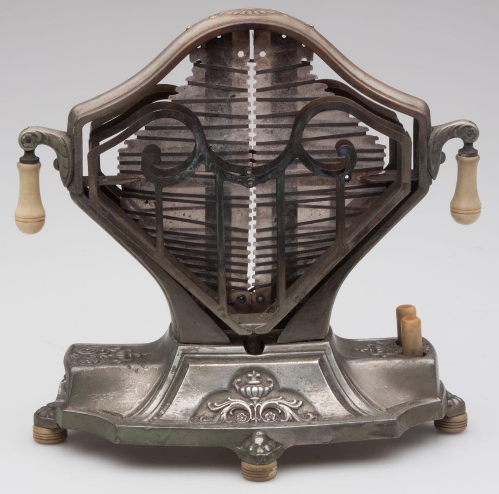 UNIVERSAL NO. E9410 SWEETHEART ELECTRIC TOASTER: UNIVERSAL NO. E9410 SWEETHEART ELECTRIC TOASTER, nickeled metal and Bakelite, original tag under base. Circa 1920. 8 1/2" H. Provenance: Collection of the late Veronica "Ronnie" Riefler Strathmann, Pi