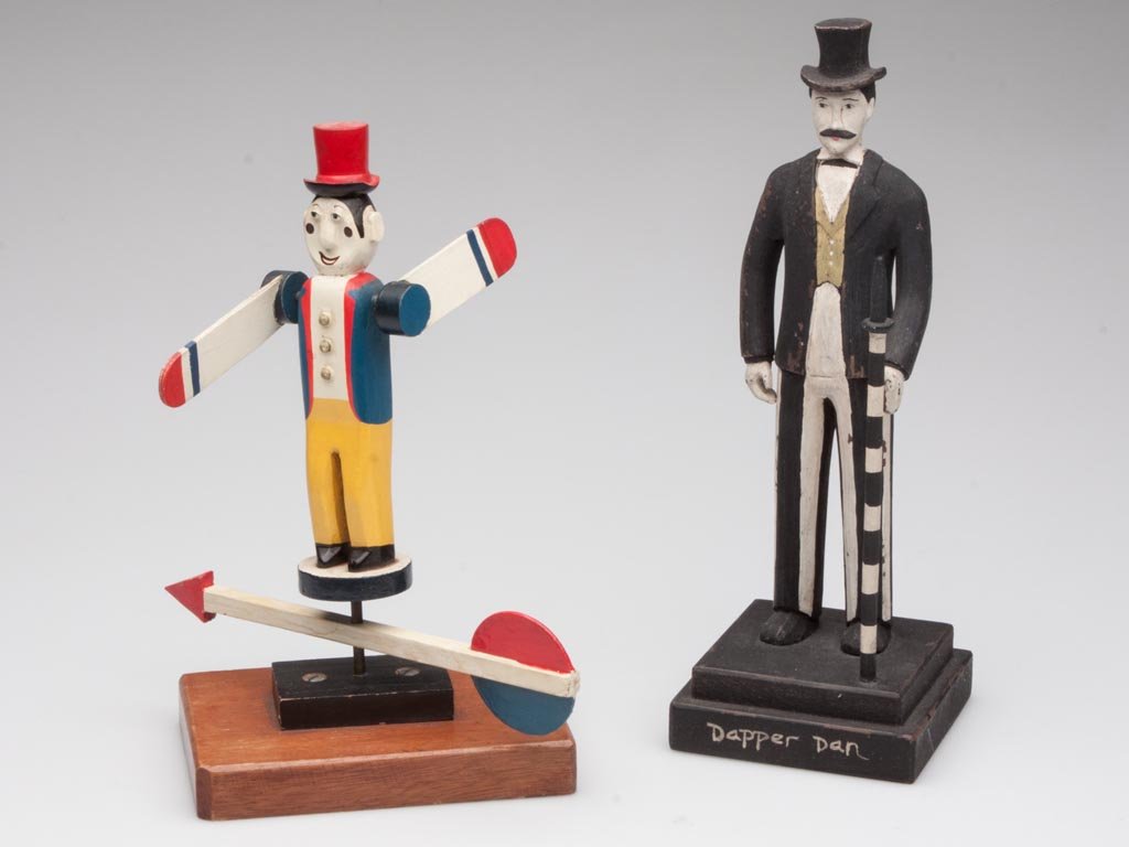 FOLK ART STYLE FIGURES, LOT OF TWO: FOLK ART STYLE FIGURES, LOT OF TWO, comprising a painted wood whirly-gig and a painted resin Dapper Dan. 20th century. 8 1/2" and 10" HOA.