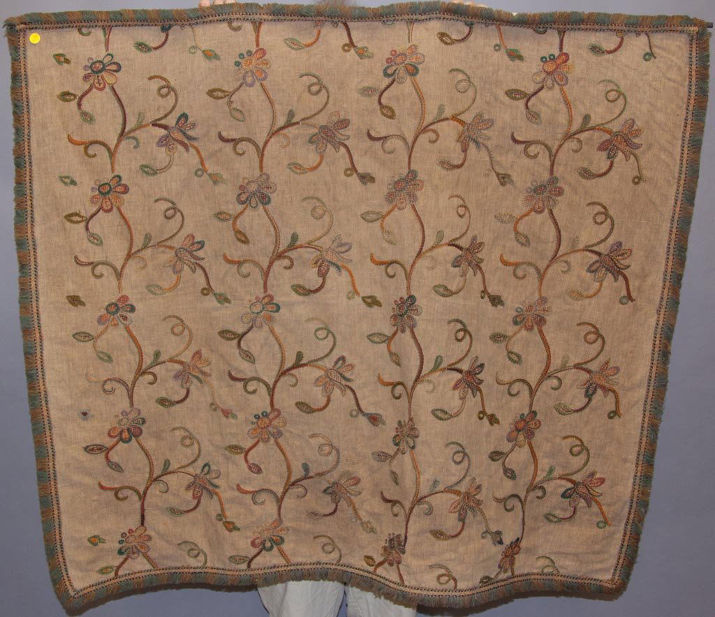 ARTS & CRAFTS NEEDLEWORK TABLE COVER: ARTS & CRAFTS NEEDLEWORK TABLE COVER, flowering vines embroidered on a linen foundation, fully fringed. Sleeve attached for hanging. Late 19th/early 20th century. 42" x 48". Provenance: From a Connect