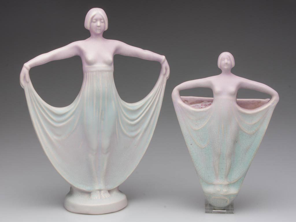 WELLER HOBART / LAVONIA ART POTTERY ARTICLES, LOT OF TW: WELLER HOBART / LAVONIA ART POTTERY ARTICLES, LOT OF TWO, lilac to turquoise glaze, comprising a semi-nude female two-compartment vase and wall pocket, latter with ink-stamp mark. Circa 1925. 10 1/2"