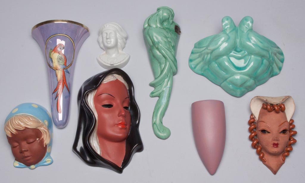 ASSORTED CERAMIC WALL POCKETS AND MASKS, LOT OF EIGHT: ASSORTED CERAMIC WALL POCKETS AND MASKS, LOT OF EIGHT, including Noritake, Stangl and Goldscheider. 20th century. 3 3/4" to 10" H. Provenance: The collection of the late Richard "Dick" and Mary Ann Kr