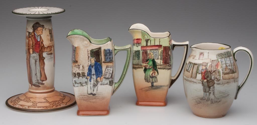 ROYAL DOULTON DICKENSWARE ARTICLES, LOT OF 4: ROYAL DOULTON DICKENSWARE ARTICLES, LOT OF 4, comprising a "The Artful Dodger" candlestick; a "Bill Sykes" cream jug; an "Old Peggoty" pitcher; and a "Little Nell" pitcher, each with deep green line r
