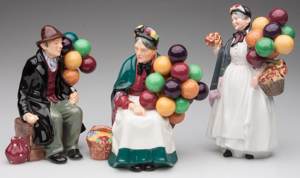 ROYAL DOULTON FIGURINES, LOT OF THREE: ROYAL DOULTON FIGURINES, LOT OF THREE, comprising "Balloon Man" HN 1954; "The Old Balloon Seller" HN 1315; and "Biddy Penny Farthin" HN 1843. 1937 to 1954. 7 1/2" to 9" HOA. Provenance: From the estat