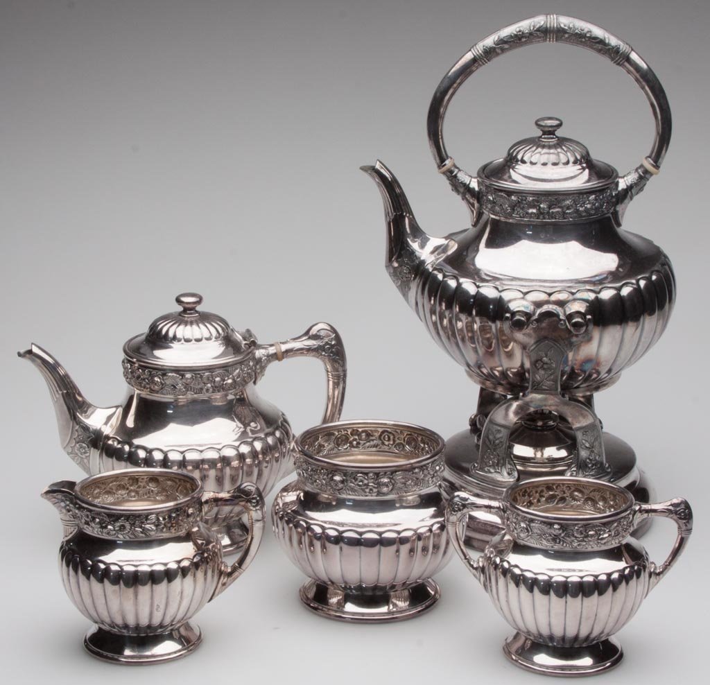 REED & BARTON VICTORIAN SILVER-PLATE FIVE-PIECE TEA SER: REED & BARTON VICTORIAN SILVER-PLATE FIVE-PIECE TEA SERVICE, comprising a hot-water kettle and stand, teapot, creamer, open sugar and spooner, fully marked and numbered "3221" under bases, kettle engr