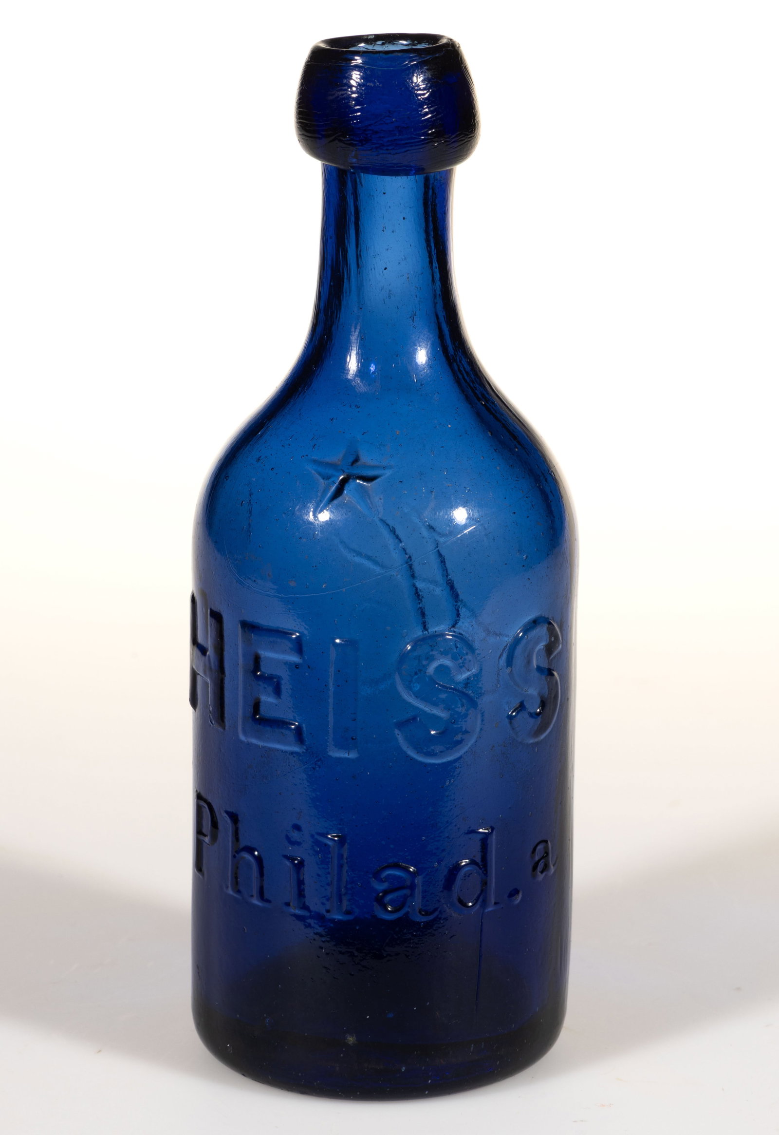 PHILADELPHIA, PENNSYLVANIA UNION GLASS WORKS "HEISS" SQUAT SODA BOTTLE: PHILADELPHIA, PENNSYLVANIA UNION GLASS WORKS "HEISS" SQUAT SODA BOTTLE, cobalt blue, cylindrical form, one side embossed with a five-pointed star at shoulder above "HEISS" in bold 