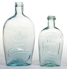 ASSORTED "DOUBLE EAGLE" PICTORIAL / HISTORICAL FLASKS, LOT OF TWO