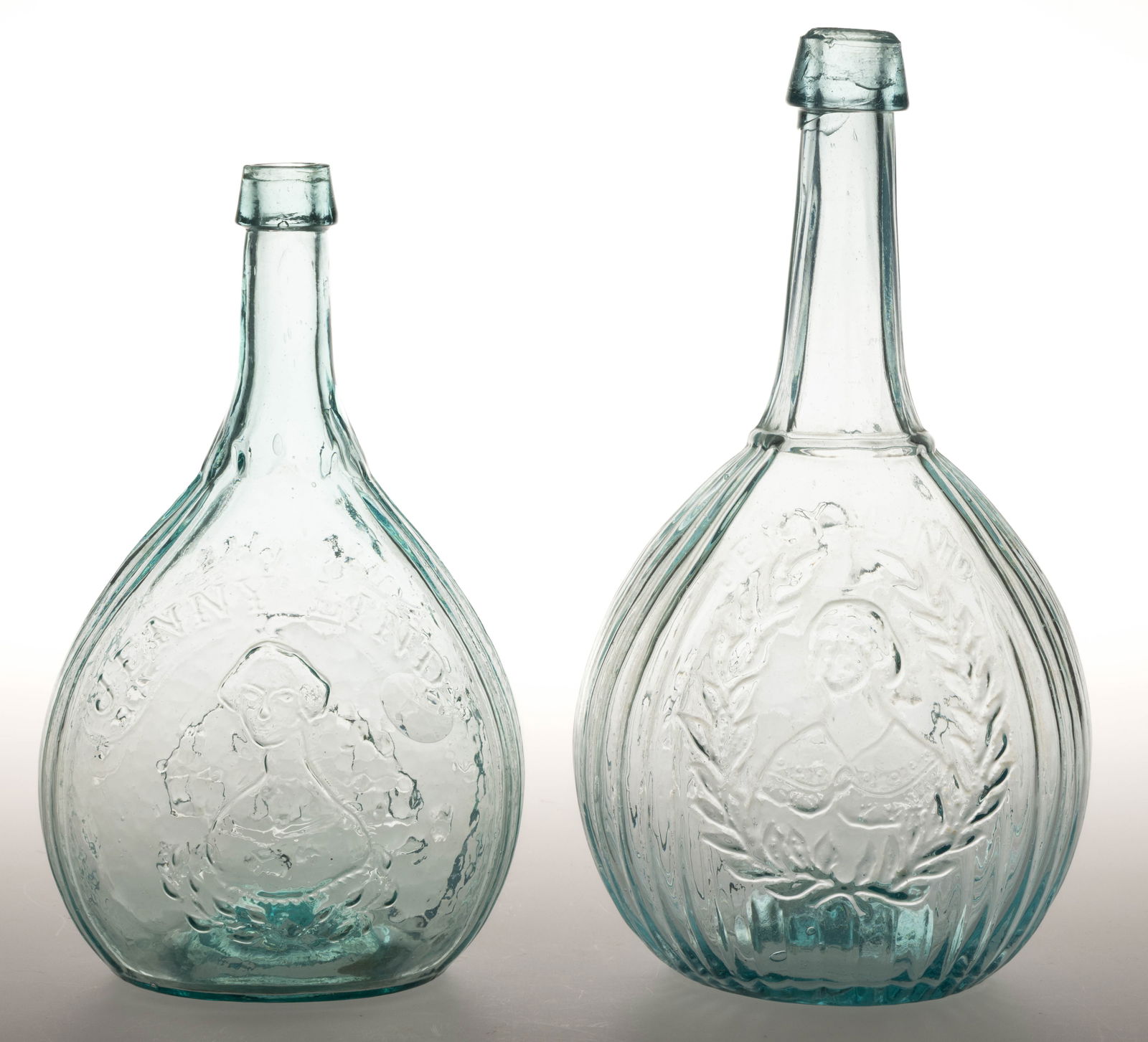 ASSORTED JENNY LIND CALABASH PORTRAIT / HISTORICAL FLASKS, LOT OF TWO: ASSORTED JENNY LIND CALABASH PORTRAIT / HISTORICAL FLASKS, LOT OF TWO, light to medium aquamarine, quart sized, each obverse embossed "JENNY LIND" or "JENY . LIND" above her wreath