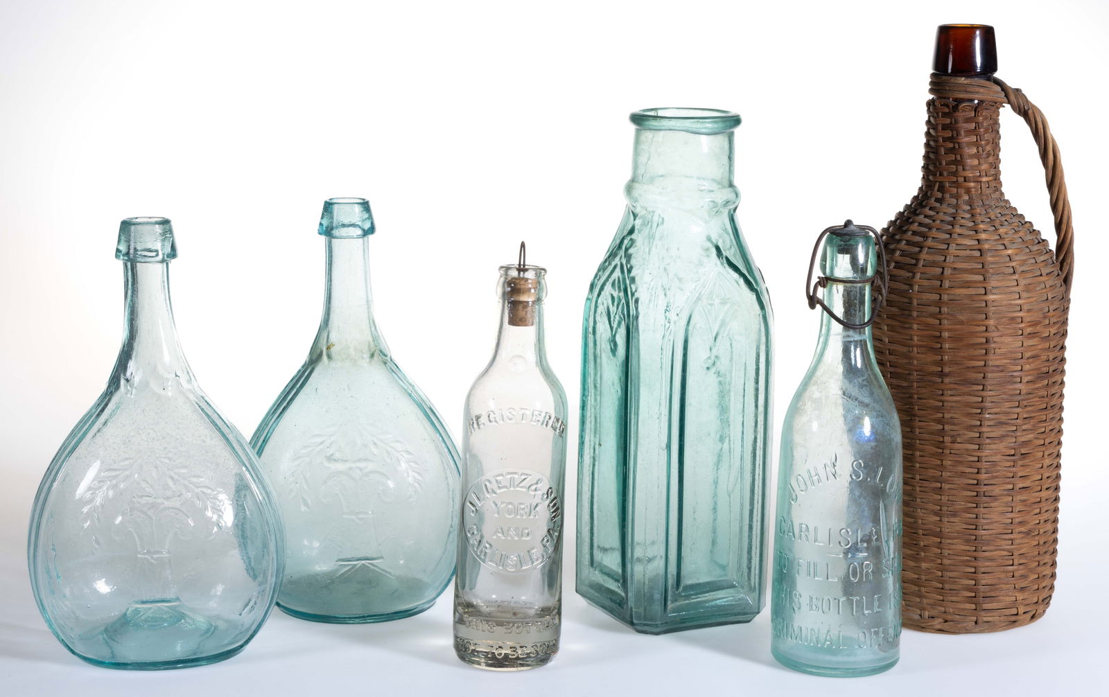 ASSORTED PICTORIAL / HISTORICAL FLASKS AND OTHER BOTTLES, LOT OF SIX: ASSORTED PICTORIAL / HISTORICAL FLASKS AND OTHER BOTTLES, LOT OF SIX, various colors, comprising two quart sized aquamarine GXIII-43 Sheaf of Wheat - Star calabash flasks, a heavily damaged