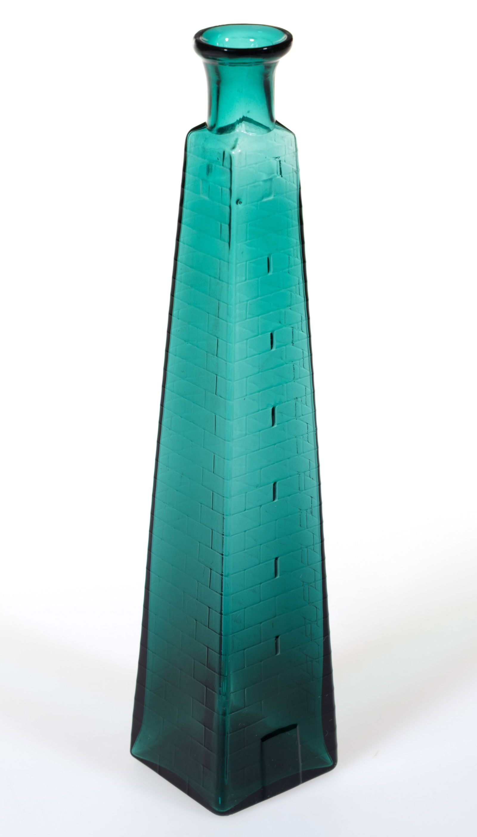 BLOWN-MOLDED FIGURAL BUNKER HILL MONUMENT COLOGNE BOTTLE: BLOWN-MOLDED FIGURAL BUNKER HILL MONUMENT COLOGNE BOTTLE, teal green, obelisk form having brick-textured surface embossing with a rectangular door at base, tooled flaring mouth, smooth base. New