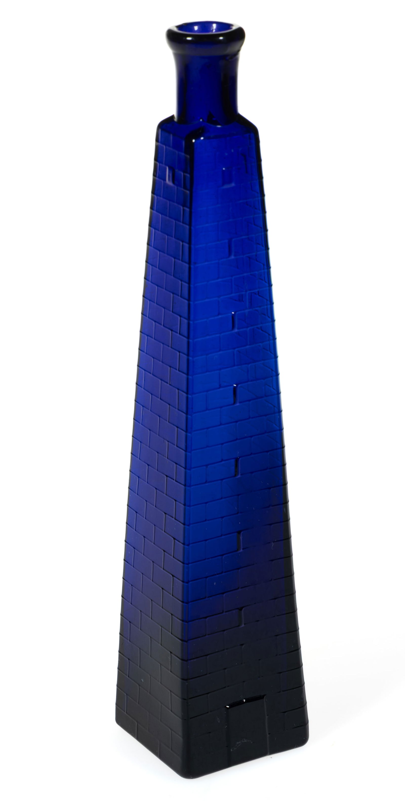 BLOWN-MOLDED FIGURAL BUNKER HILL MONUMENT COLOGNE BOTTLE: BLOWN-MOLDED FIGURAL BUNKER HILL MONUMENT COLOGNE BOTTLE, cobalt blue, obelisk form having brick-textured surface embossing with a rectangular door at base, tooled flaring mouth, smooth base. New