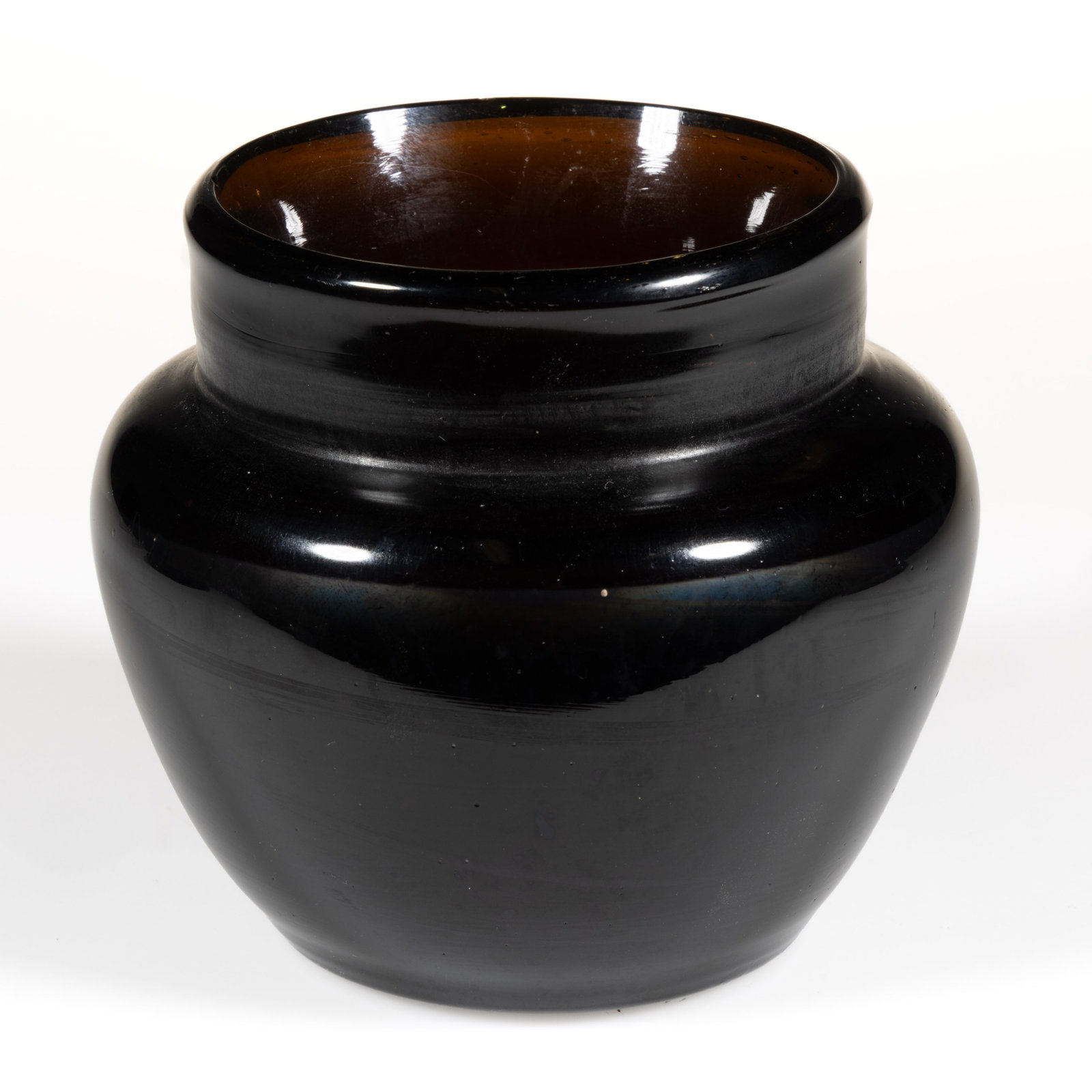 FREE-BLOWN OPEN SUGAR BOWL: FREE-BLOWN OPEN SUGAR BOWL, deep amber, truncated conical form with sharp shoulder, short cylindrical neck, and rounded-edge rim, rough pontil mark. Very heavy and thick. Poss