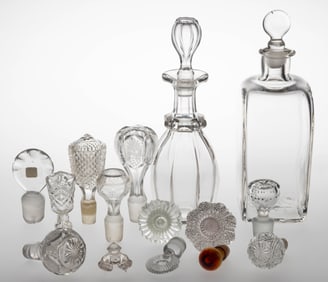 ASSORTED DECANTERS AND MISCELLANEOUS PRESSED / BLOWN GLASS STOPPERS, LOT OF 15