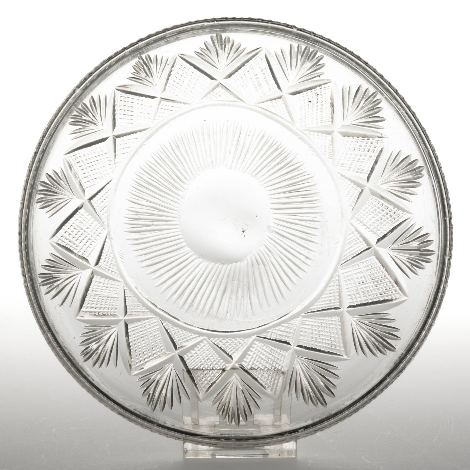 FREE-BLOWN AND CUT STRAWBERRY DIAMONDS AND FANS DISH: FREE-BLOWN AND CUT STRAWBERRY DIAMONDS AND FANS DISH, colorless lead glass, shallow hemispherical form with a band of stacked diamonds separated by deeply cut rays, outwardly-folded and finely notch-c