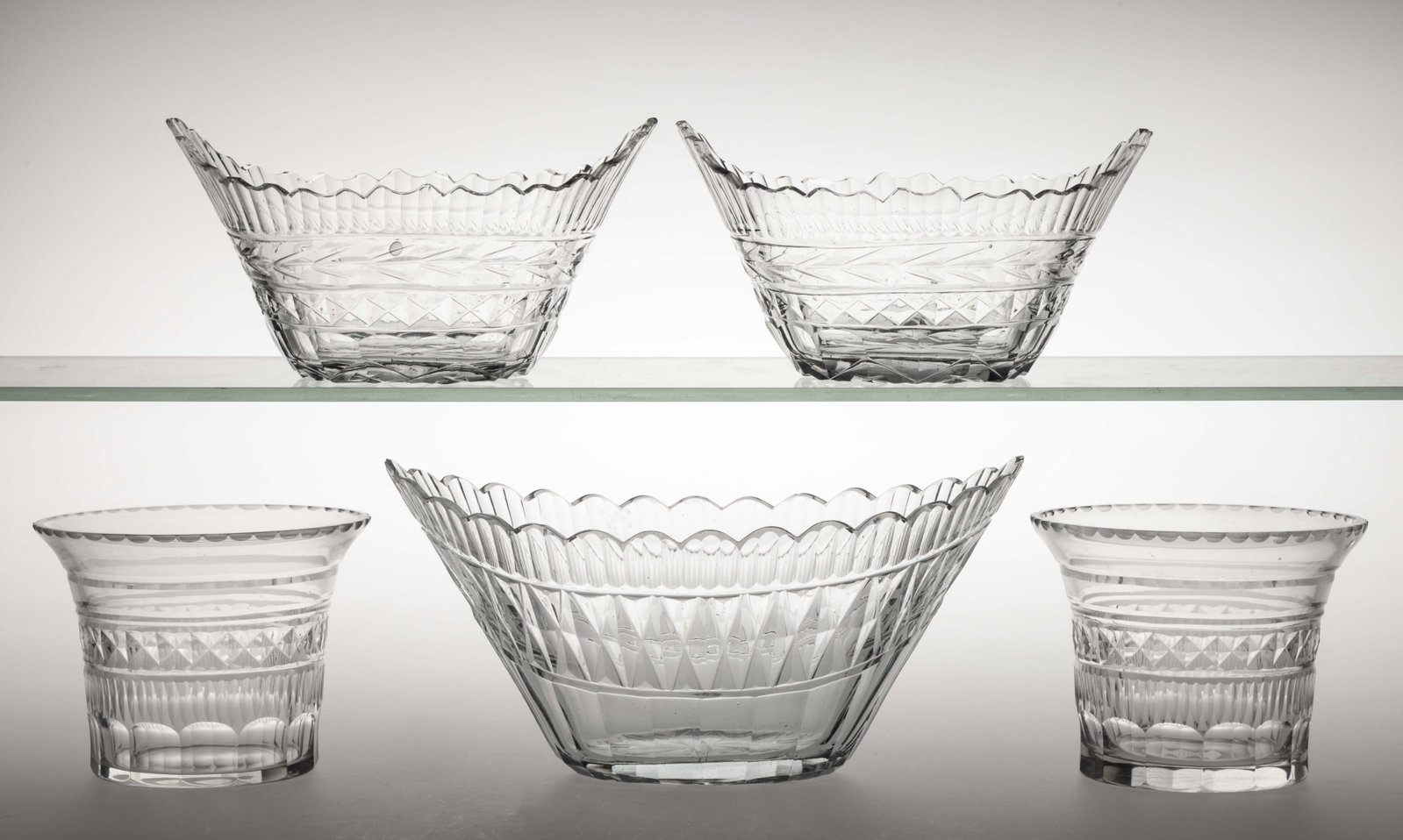 ASSORTED ANGLO-IRISH CUT GLASS BOWLS / SERVING DISHES, LOT OF FIVE: ASSORTED ANGLO-IRISH CUT GLASS BOWLS / SERVING DISHES, LOT OF FIVE, colorless, comprising a pair of cylindrical finger bowls with flaring rim, a pair of oval-form serving bowls cut with a husk band ab